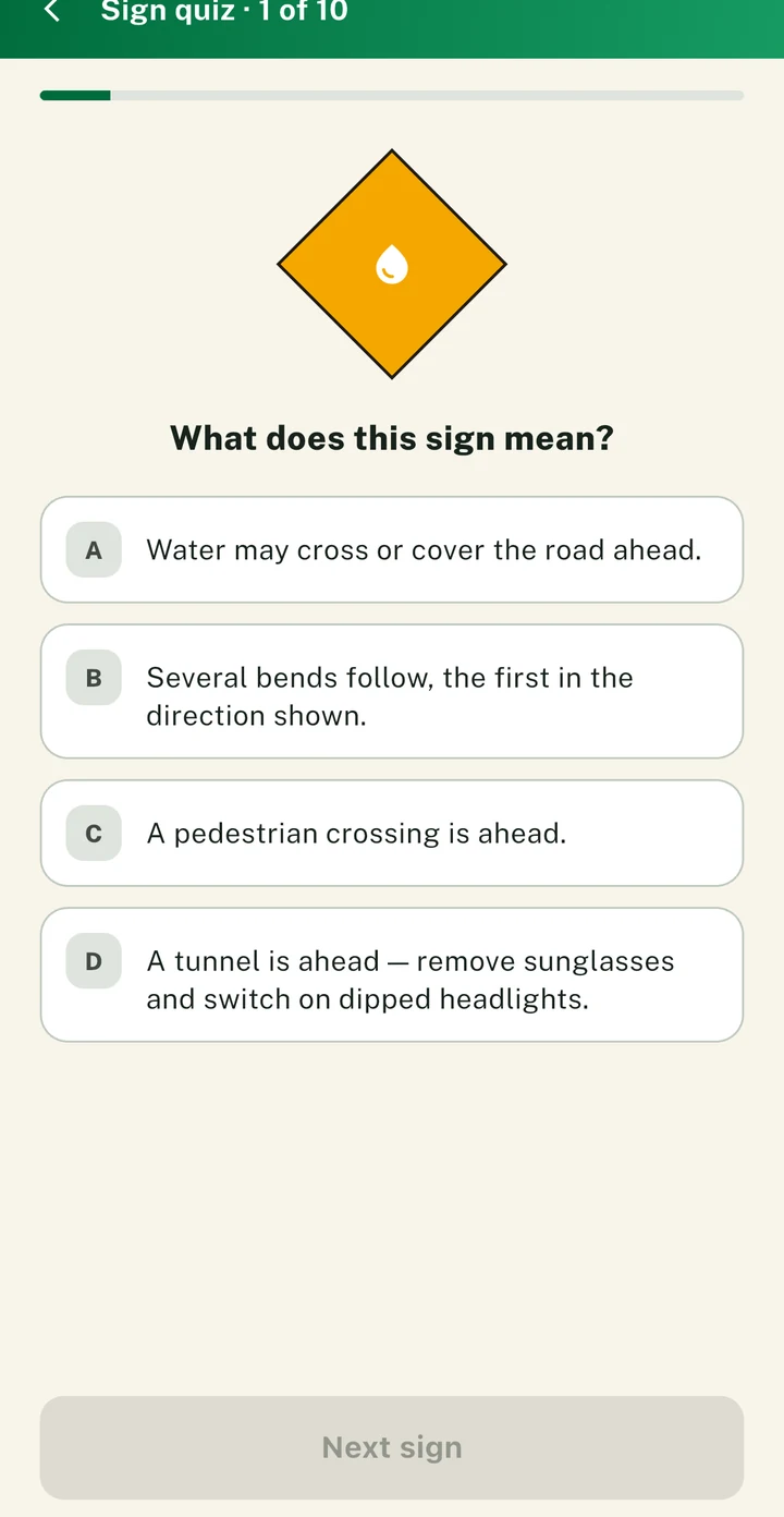 The PassDrive sign quiz asking what a warning sign means, with four options