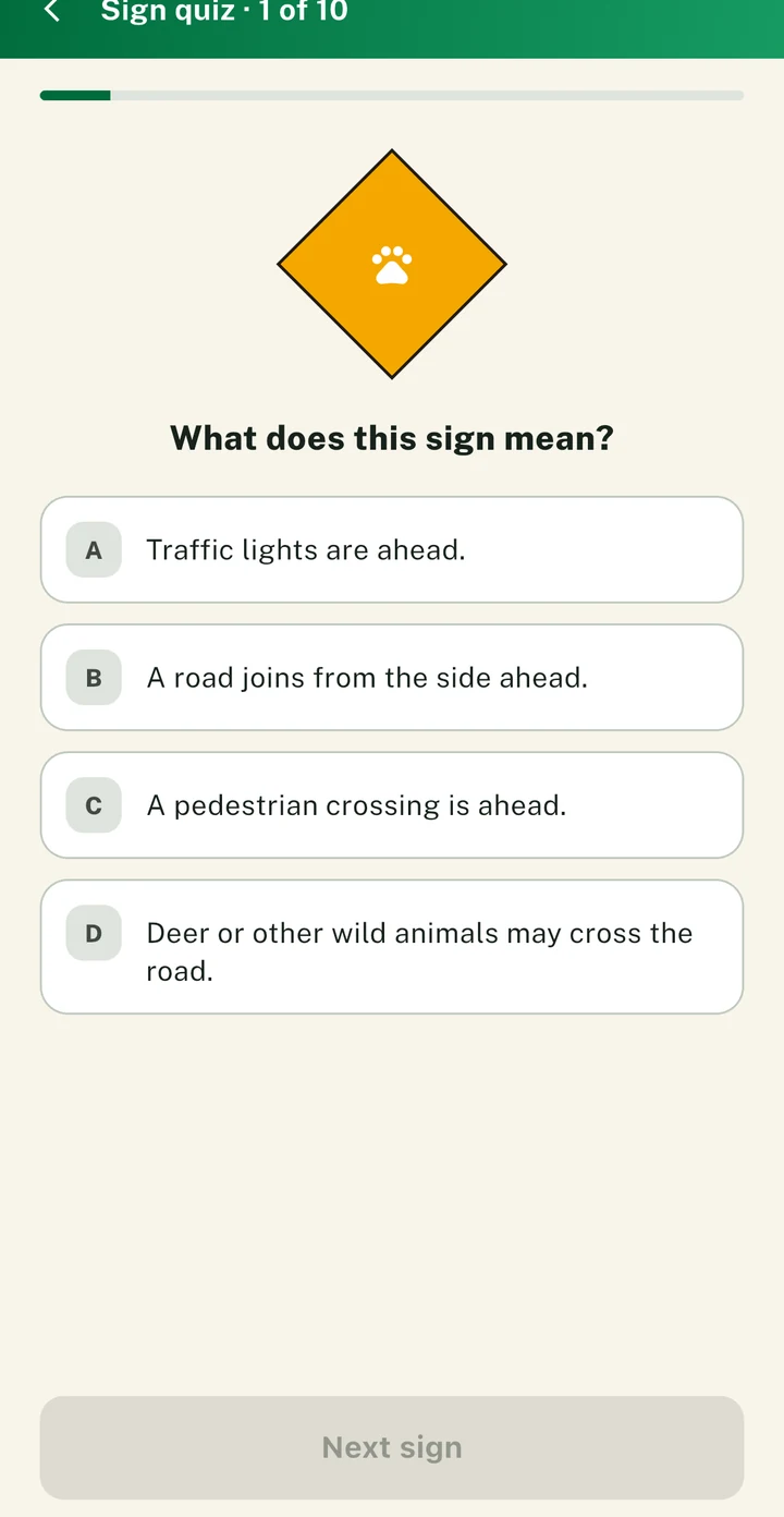 The PassDrive sign quiz asking what a warning sign means, with four options
